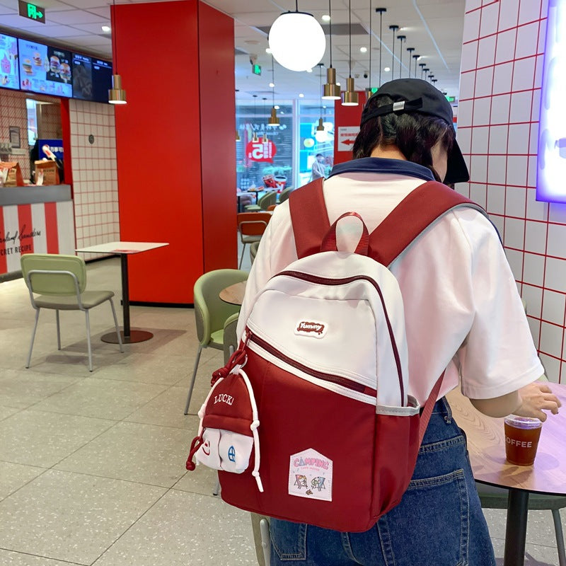 College student schoolbag, junior high school student backpack, women's summer Korean style fashion, large capacity and light high school travel backpack tide