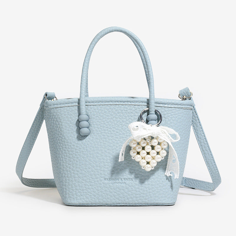 High sense fashion simple portable bucket bag women's 2025 spring and summer new casual simple solid color shoulder messenger bag