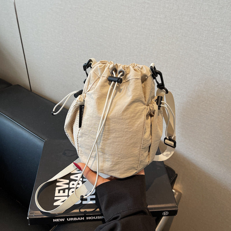 New drawstring bundle hand carry bucket bag  simple casual versatile shoulder bag outdoor commuter messenger women's bag