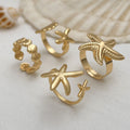 Wholesale seashell ring set - european & american ocean-inspired vacation jewelry for women - adjustable starfish open cuff bracelet