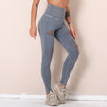 Fashion cross-border new arrival washed yoga pants with holes cut out seamless high waist sports nine-point pants butt lift fitness pants for women