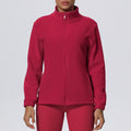 New women's solid color fleece-lined pocket stand collar zip-up casual sports jacket for running, fitness, and yoga