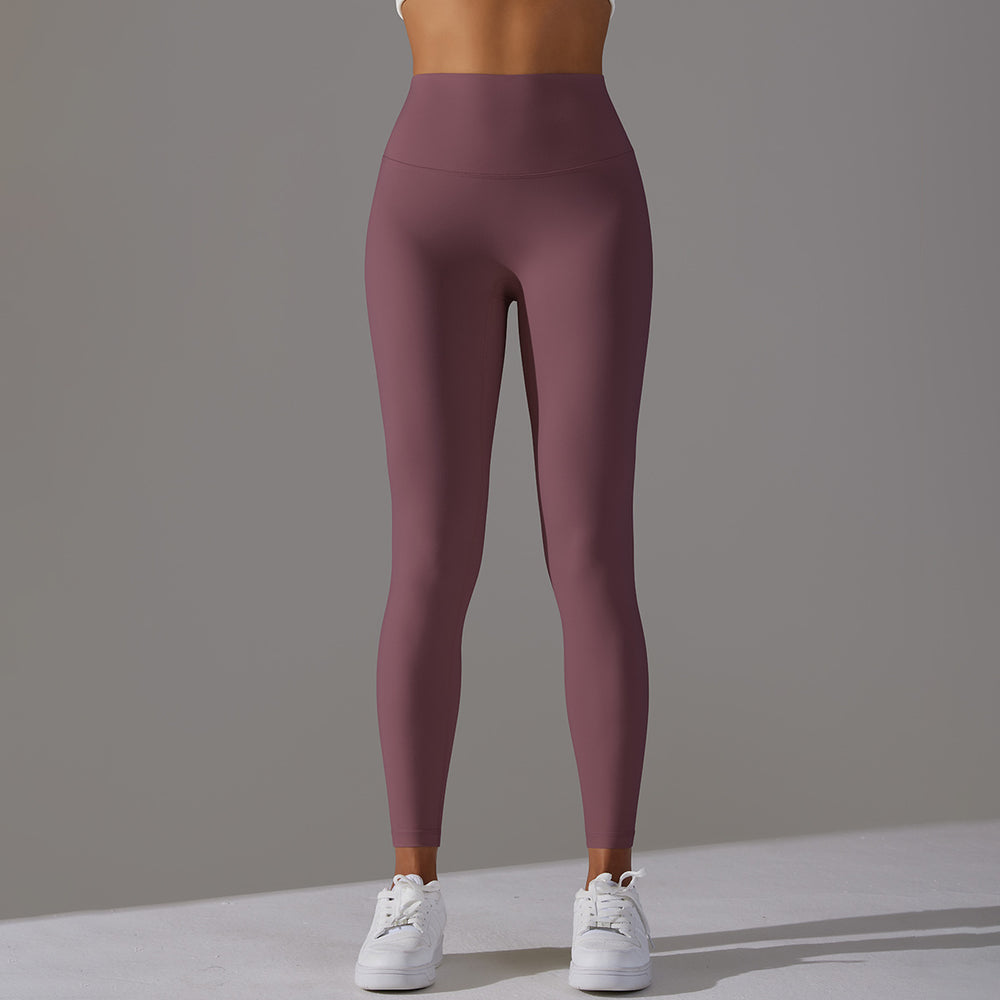 High-waisted, barely-there yoga pants for women, designed with a no-ride-up waistband for a seamless look. these figure-hugging, peach-shaped leggings offer a lift and a comfortable, stretchy fit, perfect for workouts and fitness activities. custom manufa