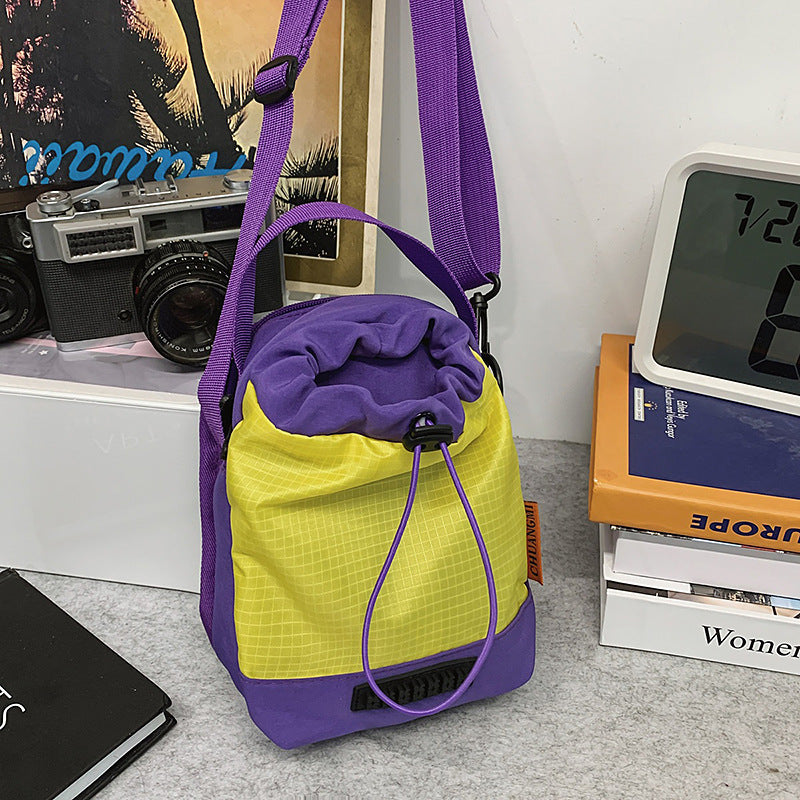 Foreign trade cute contrasting color draw belt small bag women 2025 new versatile sports and leisure shoulder messenger bag cloth bag