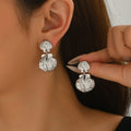 Wholesale resort-style earrings: european and american cross-border summer niche alloy stud earrings for women - exaggerated design starfish earrings