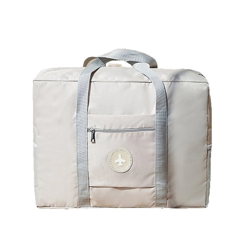 Oxford cloth aircraft standard travel bag solid color small fresh round standard tie rod bag folding travel clothing storage bag wholesale