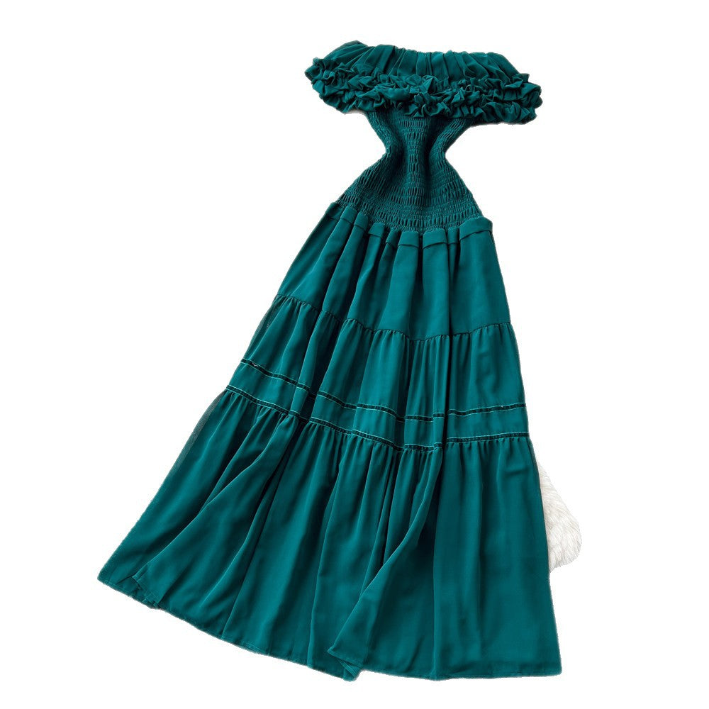 French-inspired, strapless, and stylish dress for women. high-waisted, slimming, and featuring a flattering ruffle hem. perfect for summer, this long, flowing dress comes in a chic green