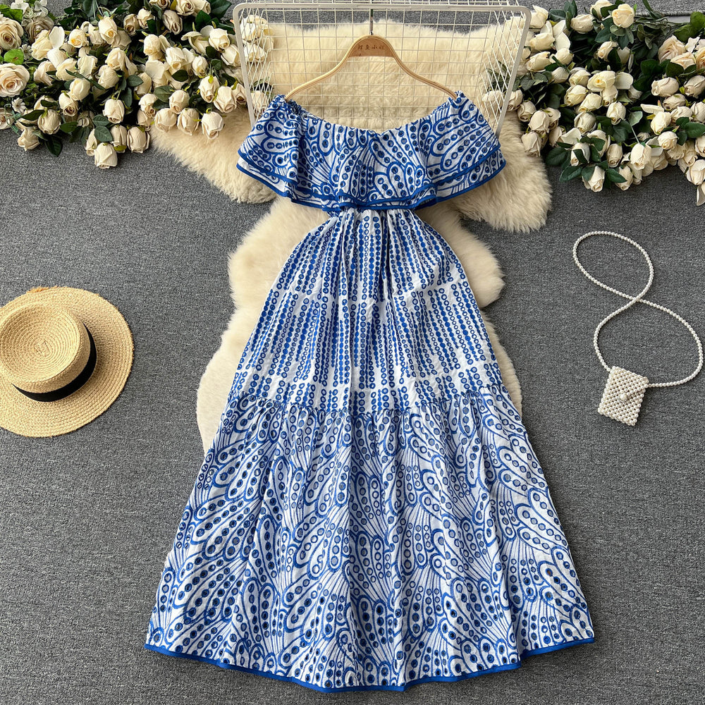 Elegant, sophisticated, and effortlessly chic: this ruffled, off-the-shoulder, lace-embroidered, and cutout maxi dress is perfect for a glamorous beach vacation