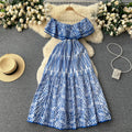Elegant, sophisticated, and effortlessly chic: this ruffled, off-the-shoulder, lace-embroidered, and cutout maxi dress is perfect for a glamorous beach vacation