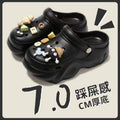 Black and white briquette black clogs@
