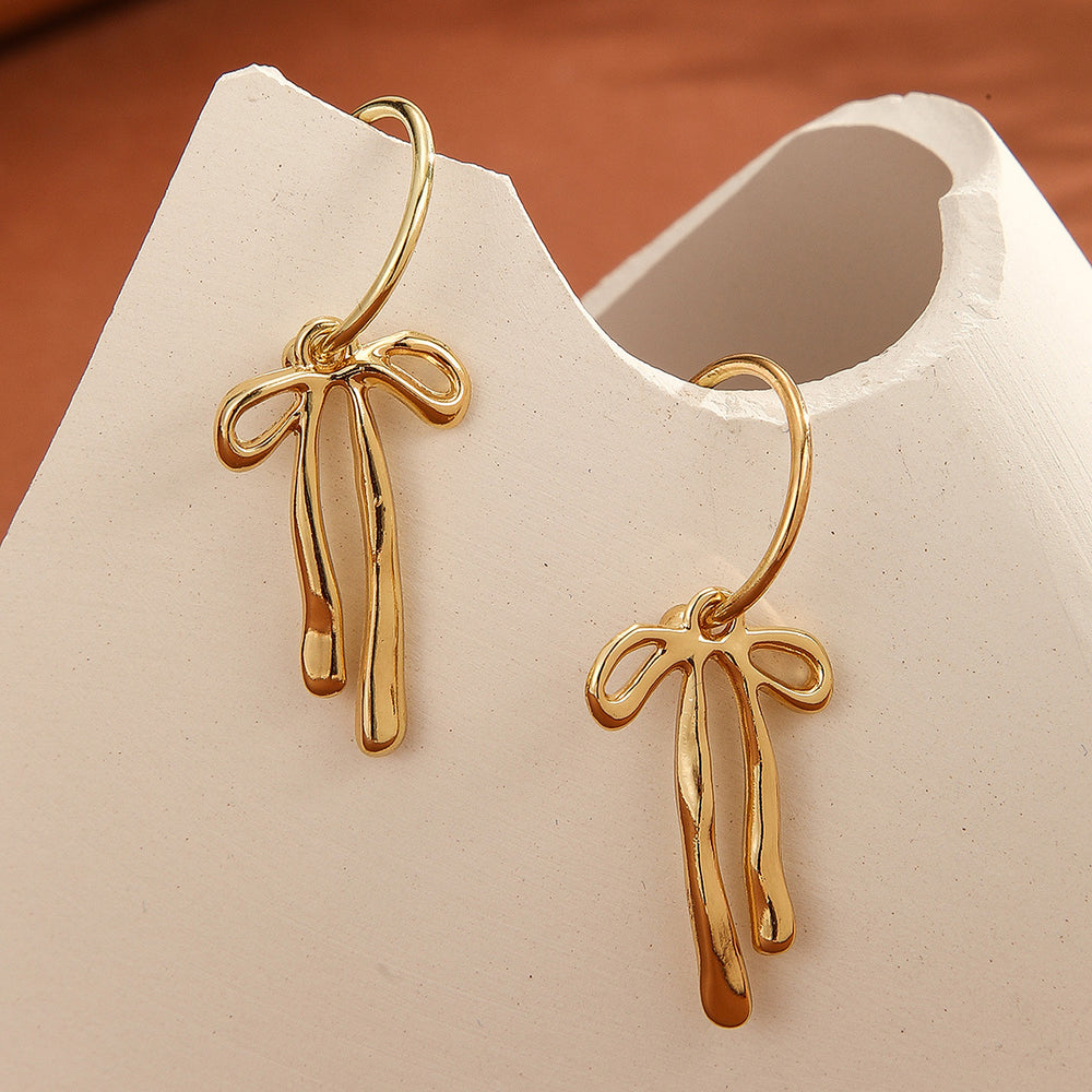Wholesale bow earrings: european & american cross-border fashion, elegant dangle earrings, minimalist niche design, gold-tone high-end stud earrings