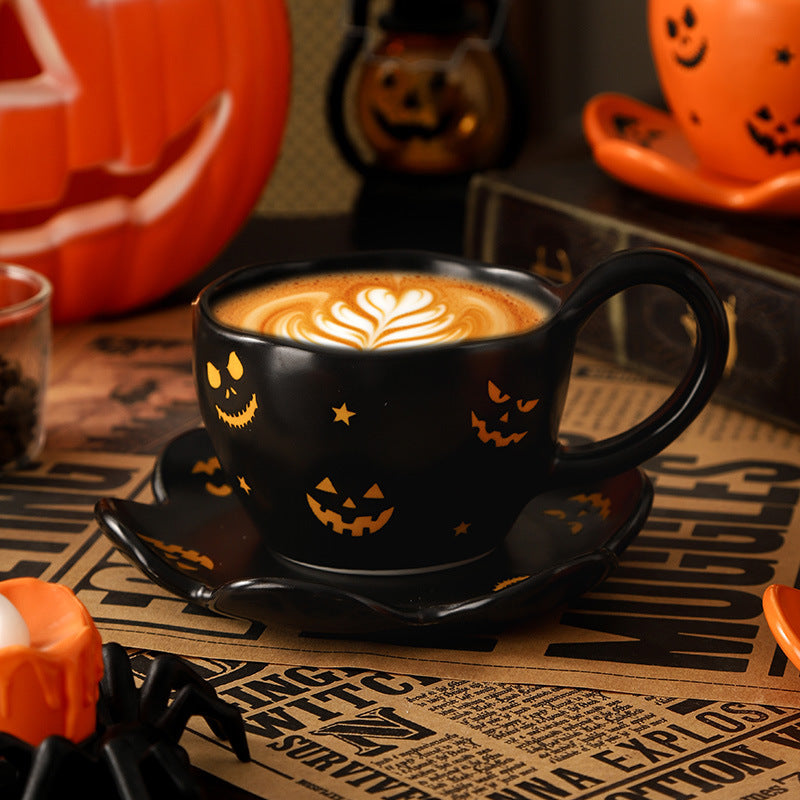 Creative halloween-themed ceramic cup and saucer set, featuring an irregular design with pumpkin and bat motifs. perfect for coffee or tea