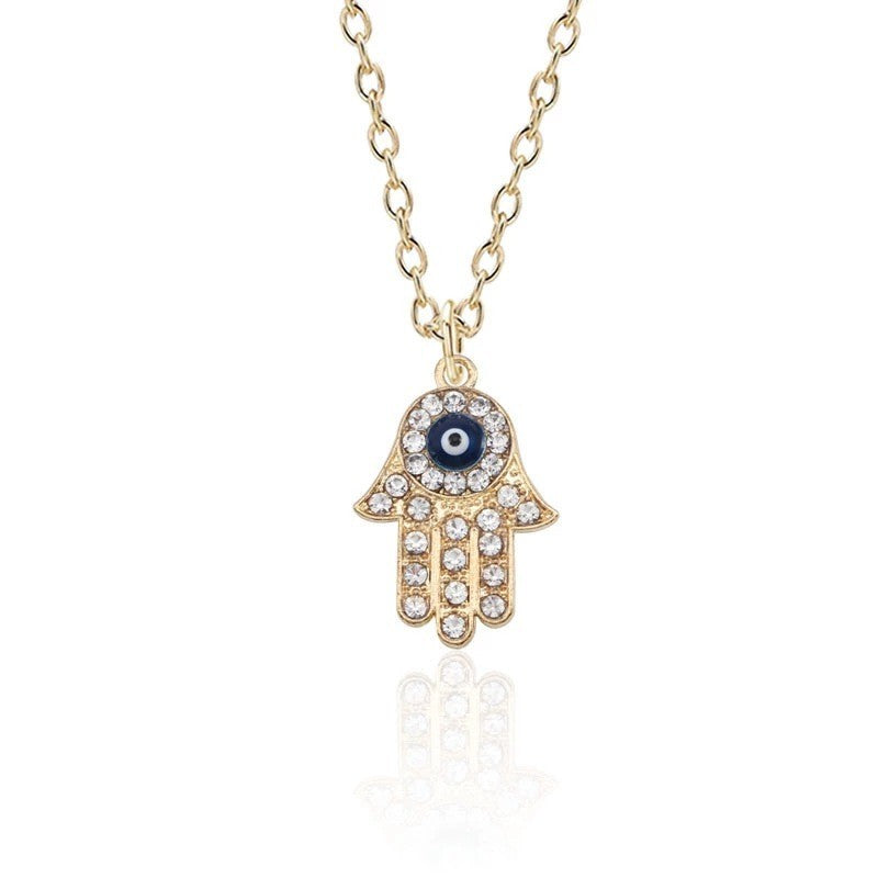 Gold-plated hand chain with rhinestone accents - vintage-inspired pendant featuring an eye and palm design - wholesale from manufacturer