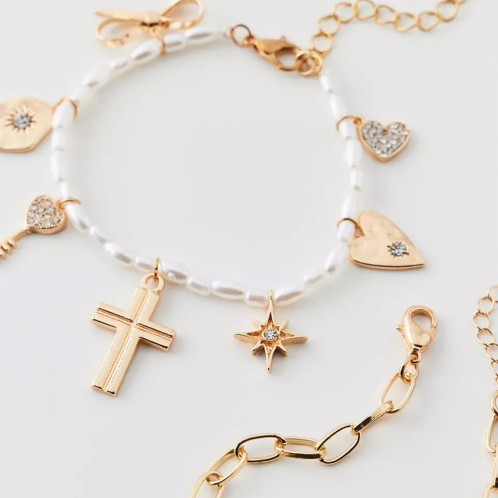 Wholesale faux pearl bracelets - european & american style, stackable, designer jewelry with cross, heart, bow, and star charms