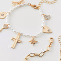 Wholesale faux pearl bracelets - european & american style, stackable, designer jewelry with cross, heart, bow, and star charms
