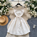High-end, understated luxury beaded round neck sleeveless dress for women. perfect for summer, this french-inspired dress features a cinched waist, a-line silhouette, and a flattering, voluminous skirt. ideal as an elegant evening gown or special occasion