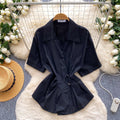 Korean-inspired, design-forward, cinched-waist blouse for women. spring collection, short-sleeved, relaxed-fit, open-front cardigan. elegant and sophisticated, with a touch of french flair