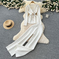 European chic: elegant and high-end strappy waist blazer-style knit top with high-waisted wide-leg pants