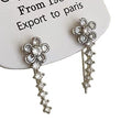 Korean-style exquisite diamond-studded flower stud earrings with an integrated ear row design. a touch of luxury, elegant and chic. trending influencer-approved accessories