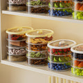 Multi-layered, stackable spice and dry ingredient storage container for home kitchens. keeps contents fresh, airtight, moisture-proof, insect-proof, and prevents flavor mingling. features a portable design