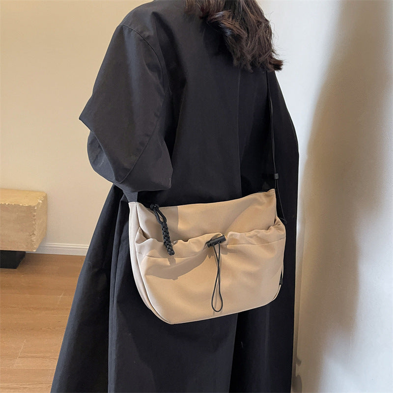 Cross-border special supply of solid color Oxford cloth messenger bag casual cloth bag 2024 new drawstring wide shoulder strap shoulder bag