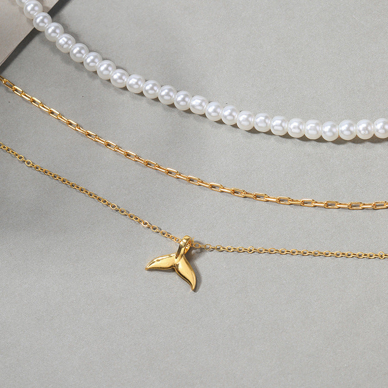 Wholesale autumn/winter sweater necklaces: european and american cross-border jewelry, women's light luxury layered necklaces, versatile high-end pearl necklaces