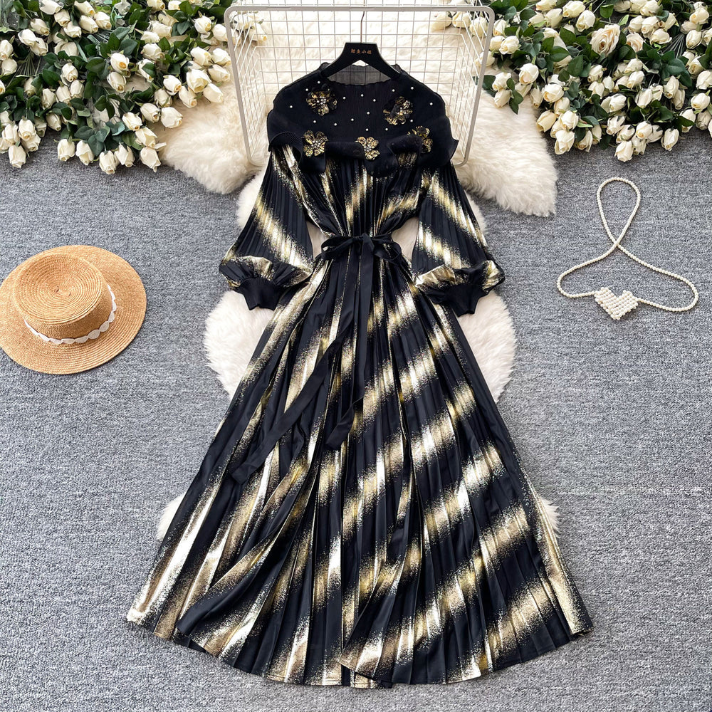 Heavy-duty beaded and gold-stamped lantern sleeve a-line dress for women, perfect for spring. features a cinched waist for a slimming effect, elegant and subtly luxurious design, and a full, flowing skirt