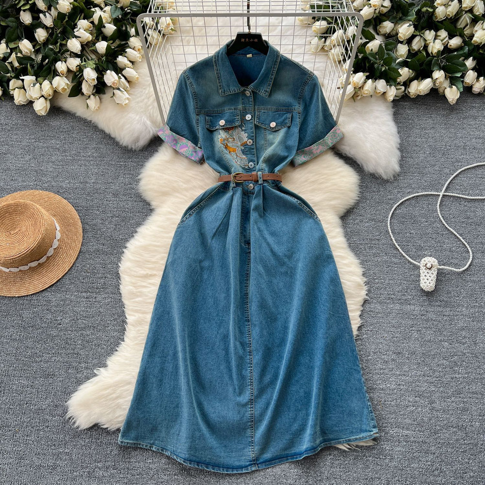 High-end women's summer dress, new arrival. features intricate embroidery, a figure-flattering cinched waist, and a sophisticated, slimming design. short-sleeved, denim, midi-length