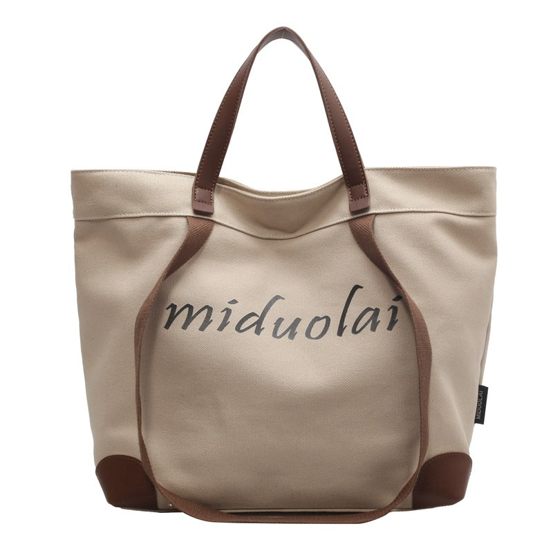 Canvas bag women's large-capacity 2023 new summer versatile simple shoulder bag cloth bag class commuter tote bag