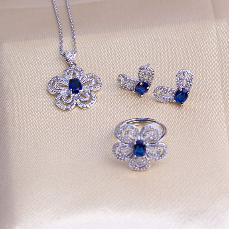 Women's jewelry set: sea blue gemstone flower necklace, earrings, and ring set - minimalist, stylish, and luxurious titanium steel pendant