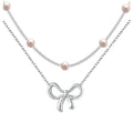 European and american cross-border new multi-layer choker necklace for women, simple and elegant bowknot faux pearl pendant necklace gift