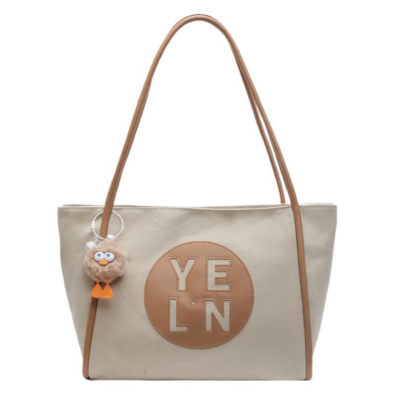 Canvas large capacity letter tote bag women's bag 2025 new casual simple handbag commuter versatile shoulder bag