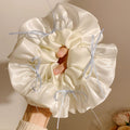 Sweet ballet style satin bow scrunchie - perfect for ponytails, buns, and hair ties
