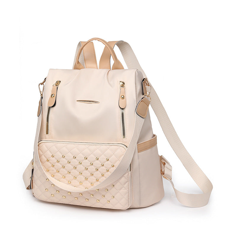 Rhombus student schoolbag large capacity fashion simple casual versatile backpack rivet inlaid women's backpack wholesale