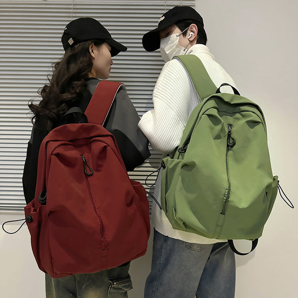 Wholesale retro schoolbag 2025 new solid color middle and high school student backpack large capacity anti-splash casual backpack
