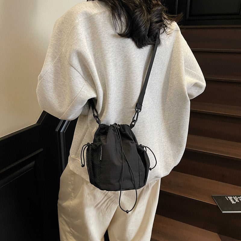 New drawstring bundle hand carry bucket bag  simple casual versatile shoulder bag outdoor commuter messenger women's bag