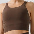 eco-friendly sports bra with thin straps, designed for yoga, running, and fitness. features built-in padding and is suitable for women