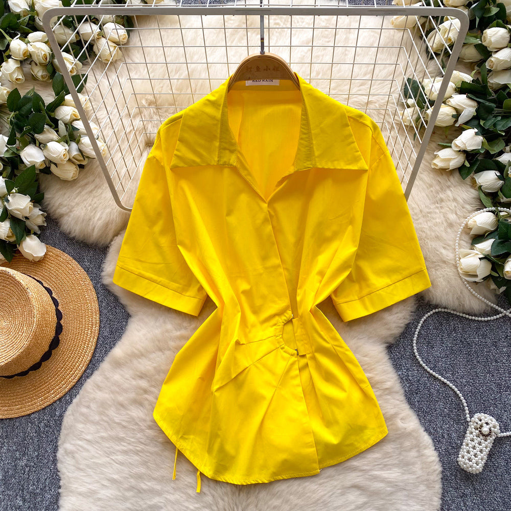 Korean-inspired, design-forward, cinched-waist blouse for women. spring collection, short-sleeved, relaxed-fit, open-front cardigan. elegant and sophisticated, with a touch of french flair