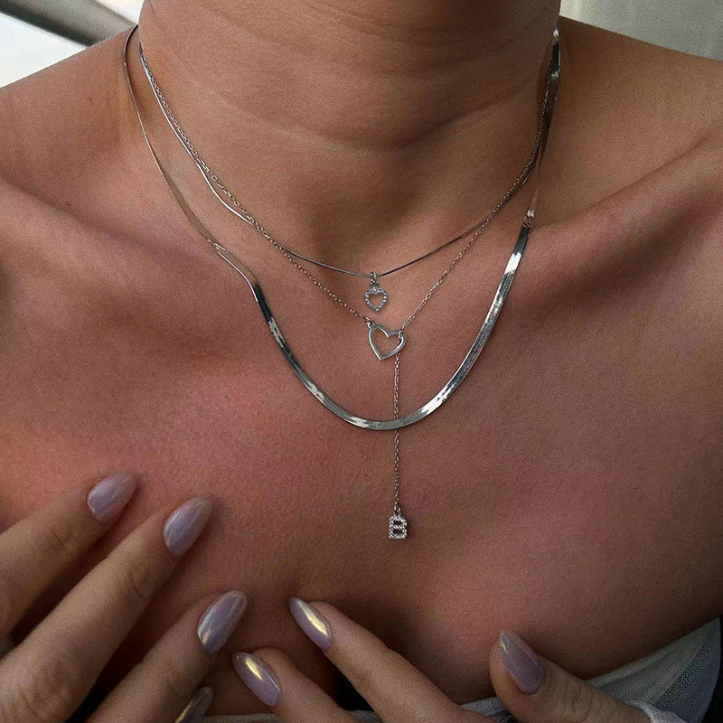 Wholesale alloy diamond-studded letter pendants, european and american cross-border jewelry, multi-layered fashion design heart necklaces for women