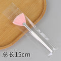 White handle pink bristle fan brush