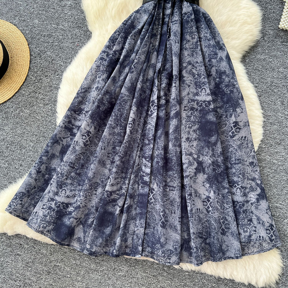 French chic, sophisticated, and unique: tie-waist, short-sleeve, single-breasted, fashionable printed pleated shirt dress with a touch of class