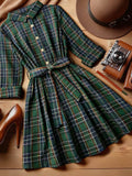 Vintage plaid shirt dress with turn-down collar, belted waist, a-line skirt, and roll-up cuffs