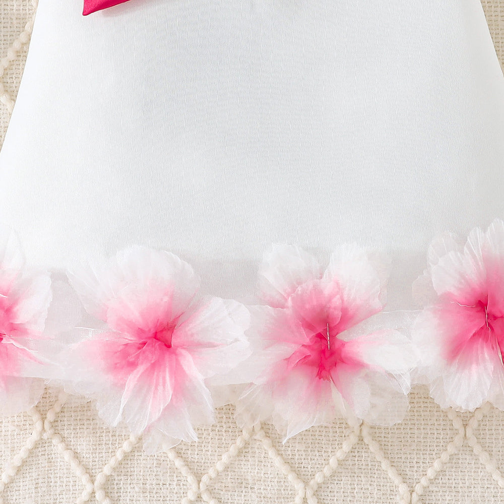 girls' solid color sleeveless party dress with 3d floral hem and bow detail