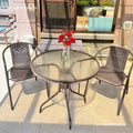 Outdoor table and chair set with umbrella, sunshade, perfect for outdoor cafes, bubble tea shops, and casual outdoor seating. features a wrought iron frame and rattan chairs, ideal for patios and gardens