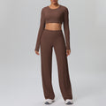 High-waisted, straight-leg, wide-leg, quick-drying yoga set with built-in bra pads, featuring a cropped, long-sleeved design. perfect for outdoor running and fitness activities for women