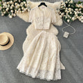 High-end, sophisticated, and feminine two-piece set for women. features a french-style lace crochet blouse with puff sleeves and a high-waisted, slimming midi skirt