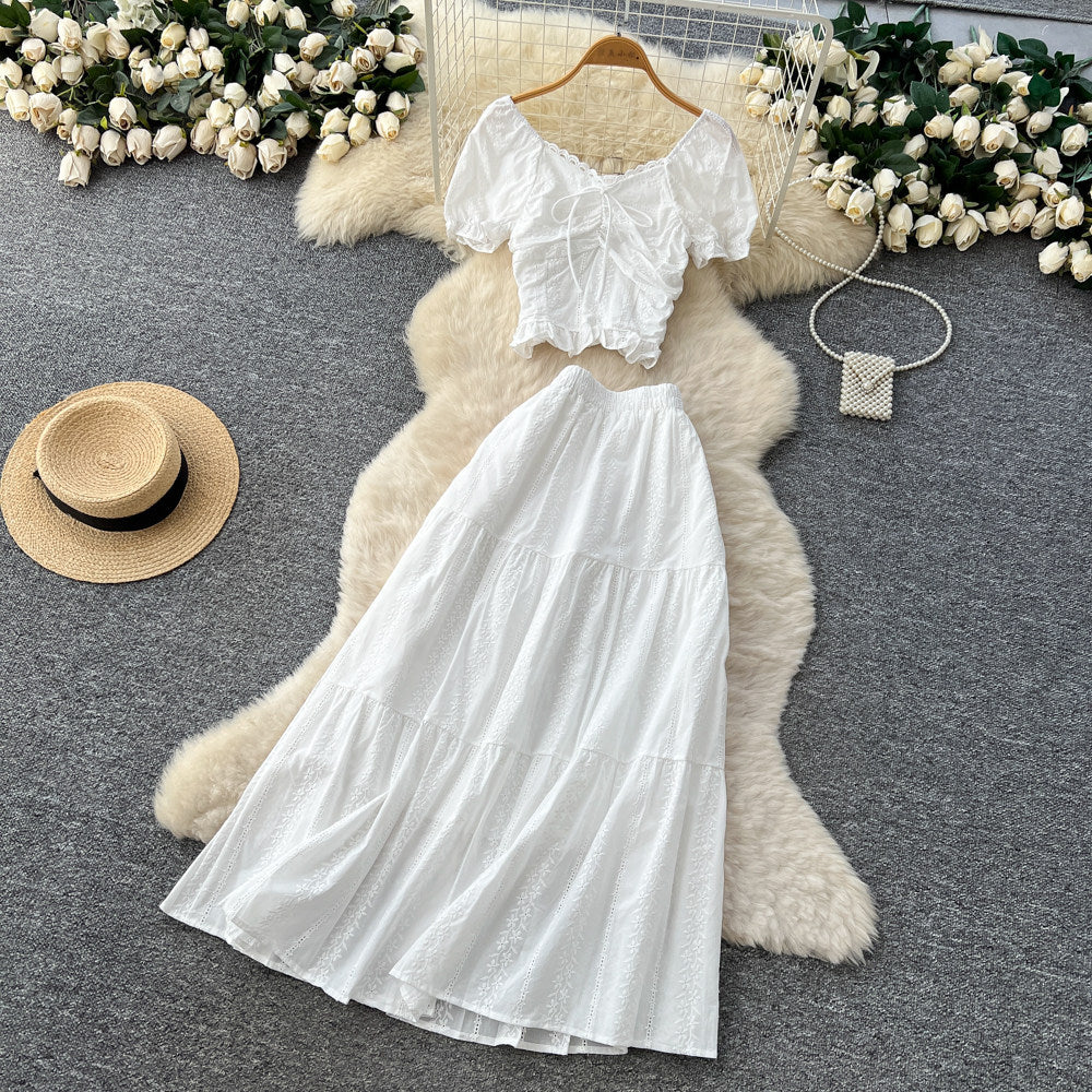 Korean-inspired, stylish and chic women's two-piece set featuring a puff-sleeve, square-neck top and a high-waisted, figure-flattering midi skirt
