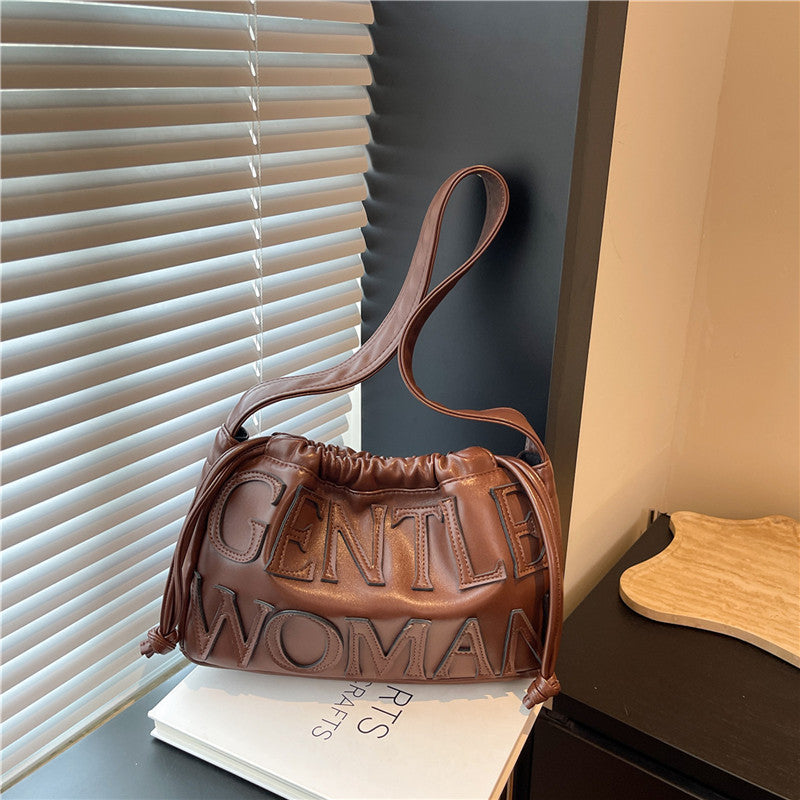 Thailand gentle woman drawstring bag women's 2026 new embossed letter shoulder bag trendy tote bag