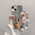 Mirror-finish apple 16 pro silver bowknot phone case, iphone 15/12 compatible, anti-drop hard protective case with wrist strap