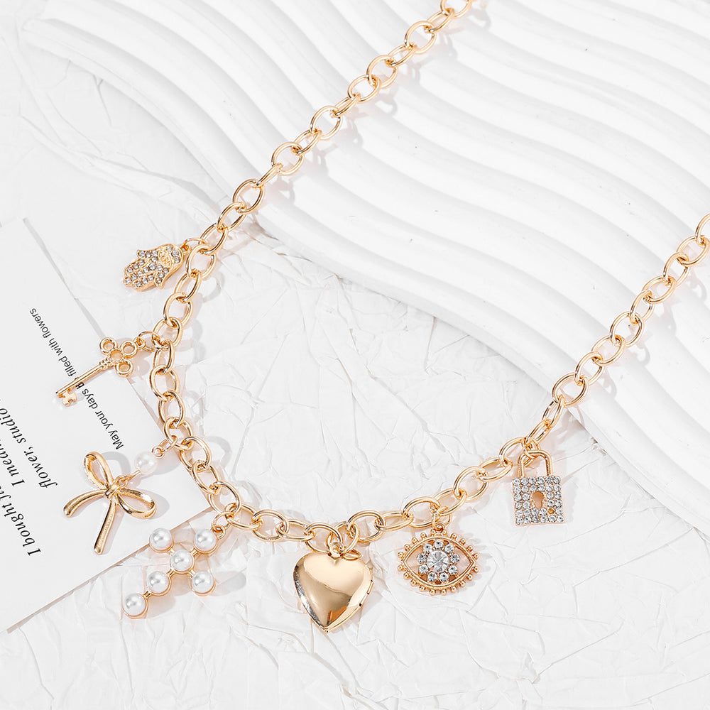 Amazon's hottest retro cross heart clavicle chain niche accessible luxury diamond-encrusted imitation pearl bow necklace for women